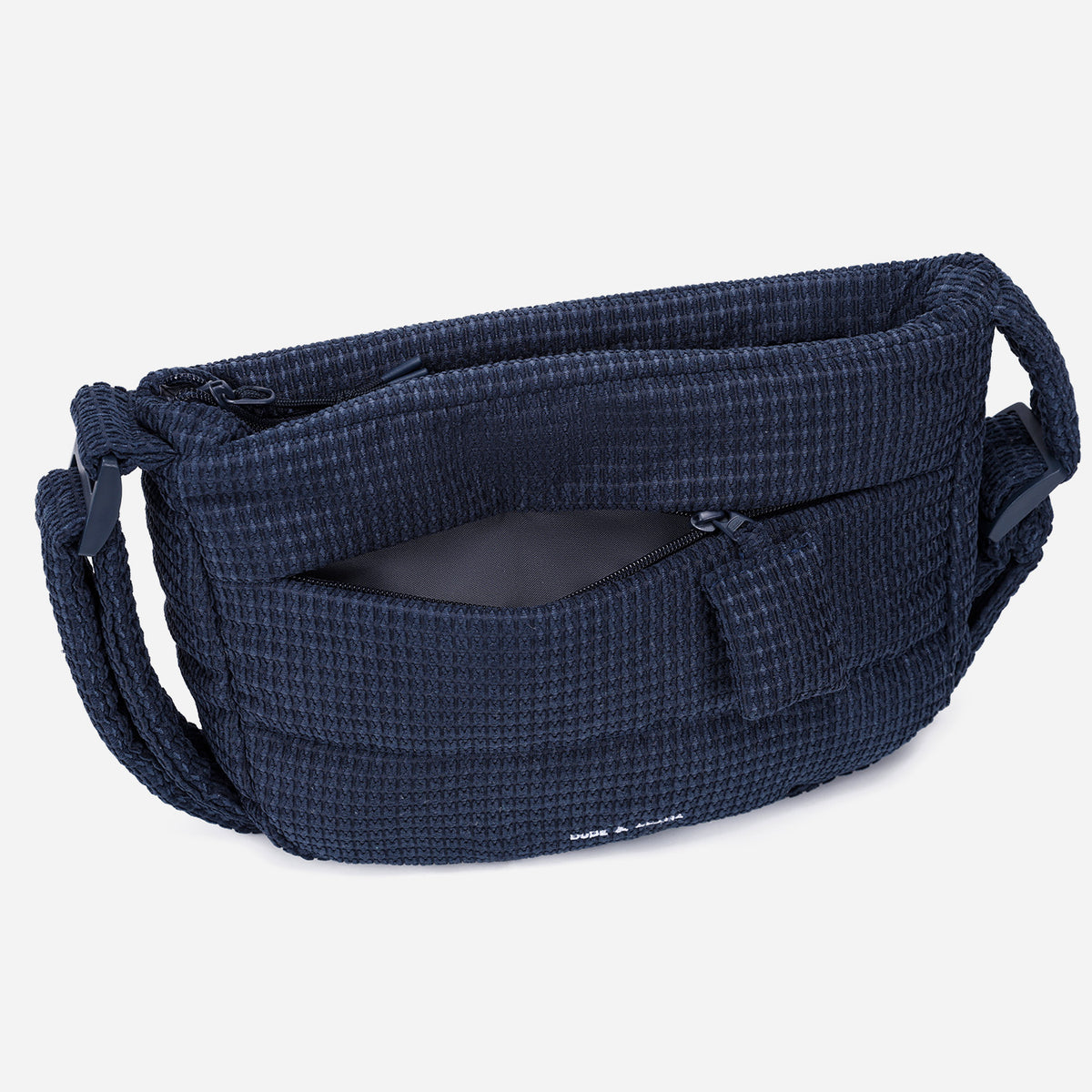 A dark navy blue woven Corduroy Puff shoulder bag by Dude & Bestie Winter 2026