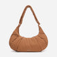 A Mocha brown puffer shoulder croissant bag by dude & bestie