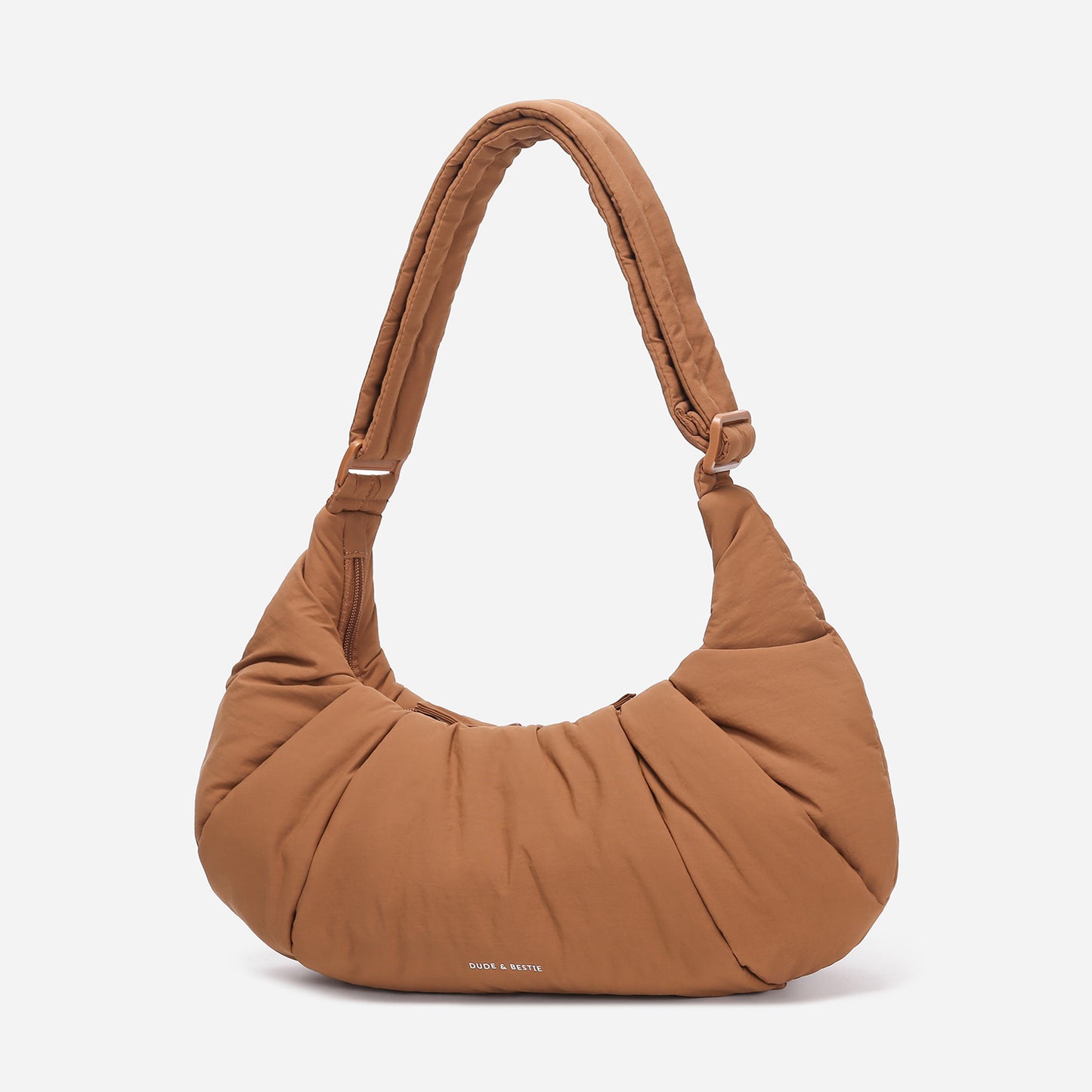 A Mocha brown puffer shoulder croissant bag by dude & bestie