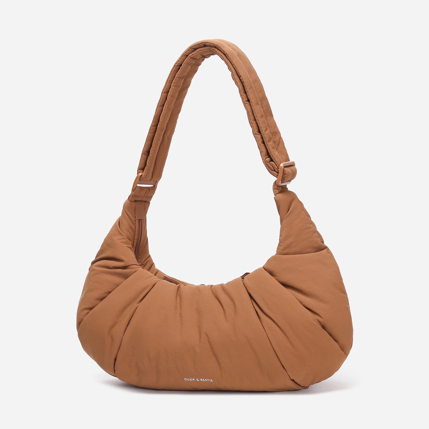 A Mocha brown puffer shoulder croissant bag by dude & bestie