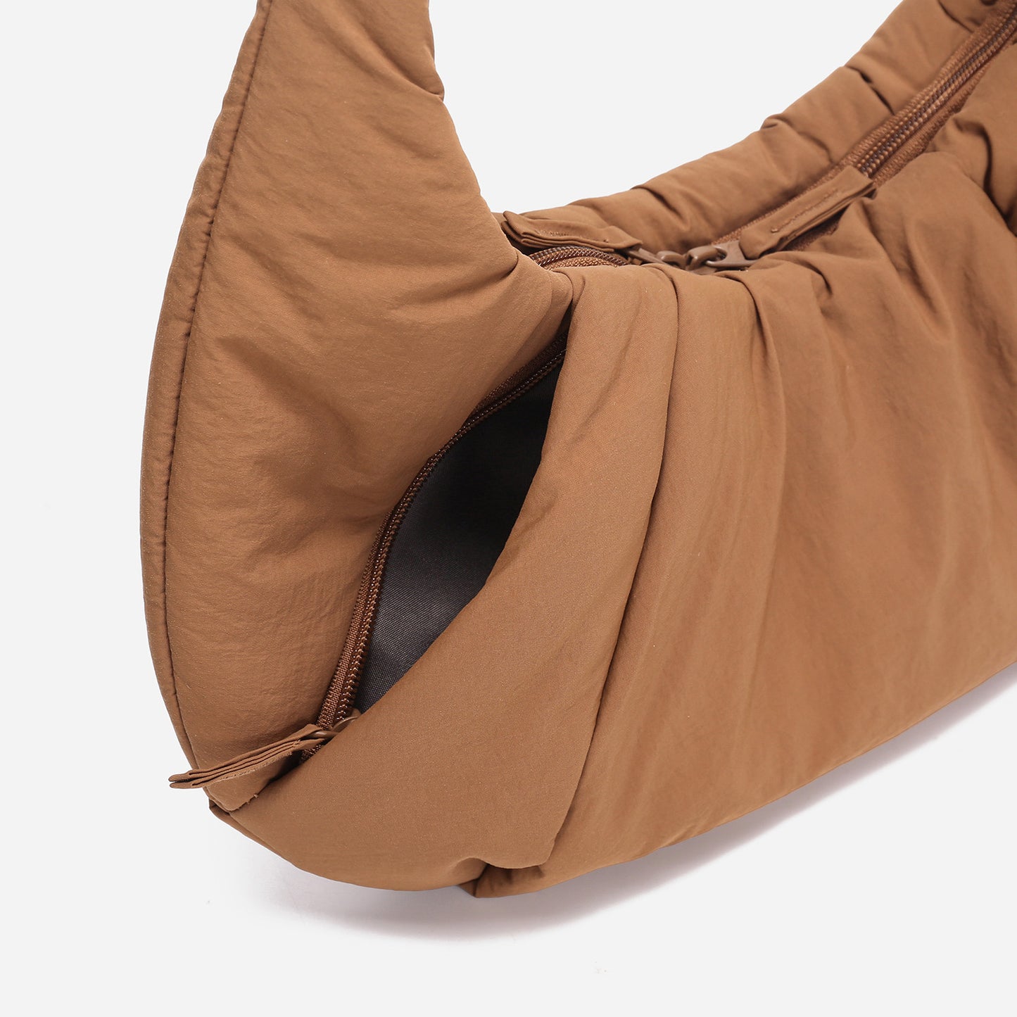 A Mocha brown puffer shoulder croissant bag by dude & bestie