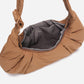 A Mocha brown puffer shoulder croissant bag by dude & bestie