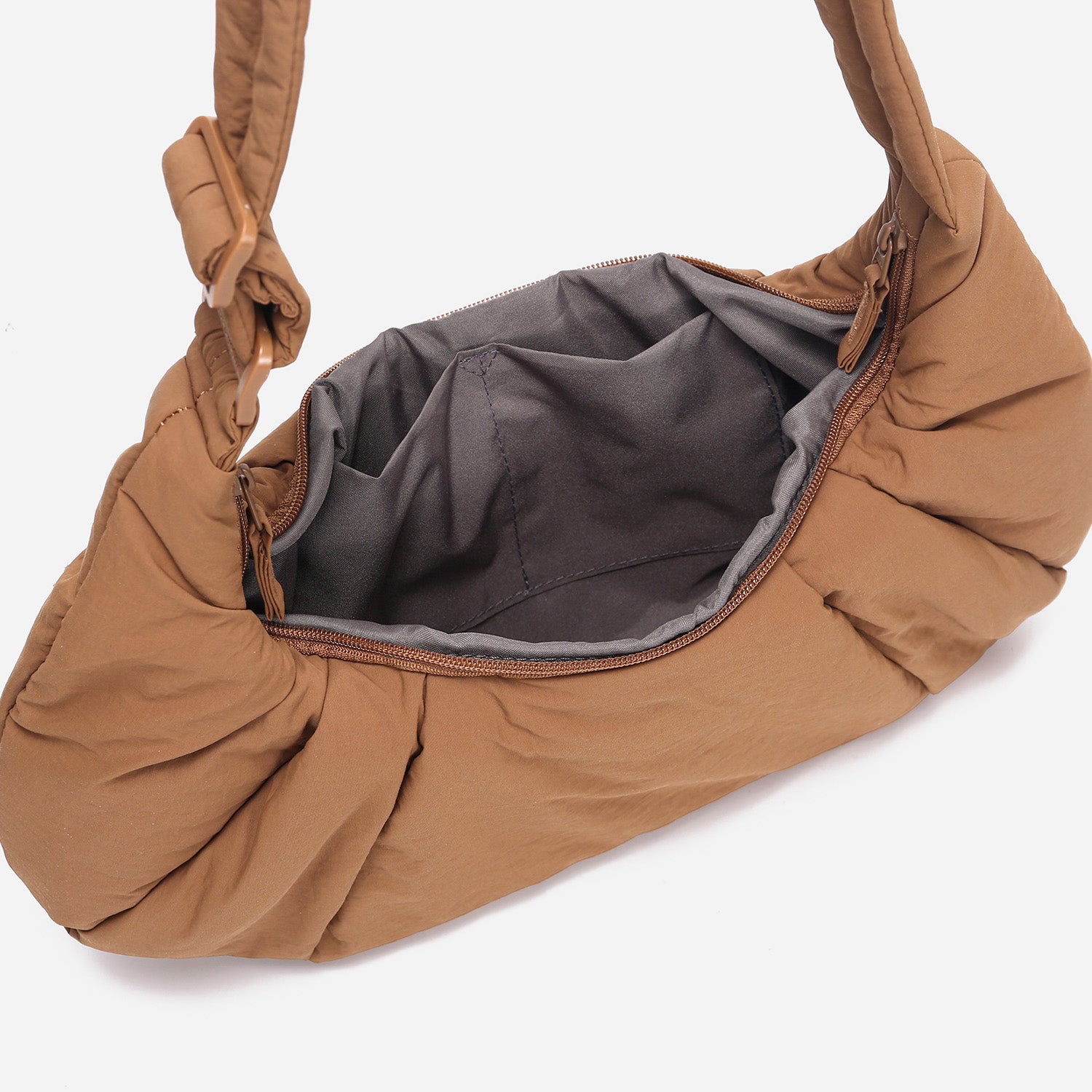 A Mocha brown puffer shoulder croissant bag by dude & bestie