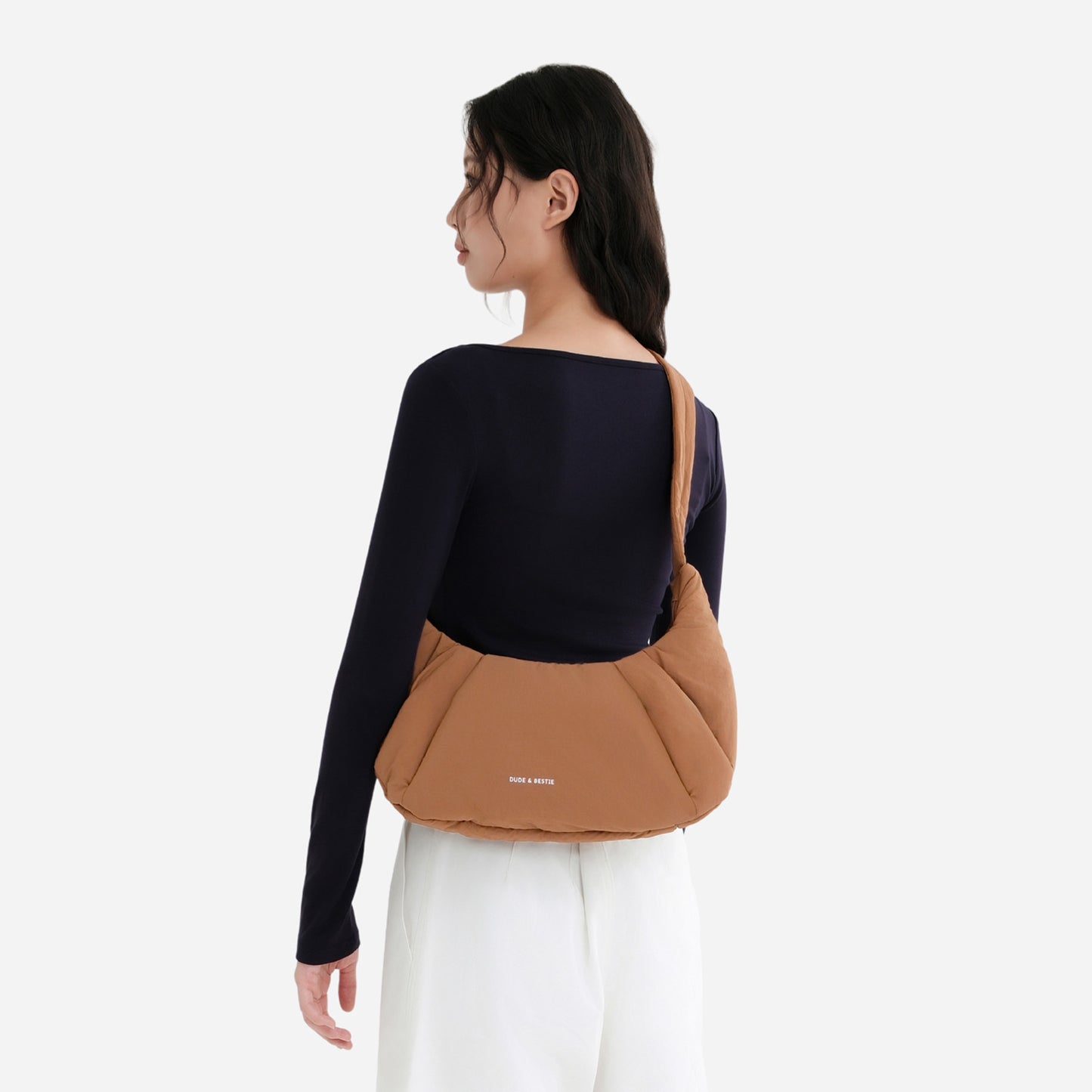 A Mocha brown puffer shoulder croissant bag by dude & bestie