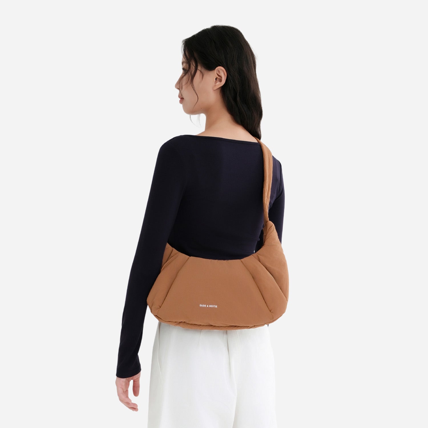 A Mocha brown puffer shoulder croissant bag by dude & bestie