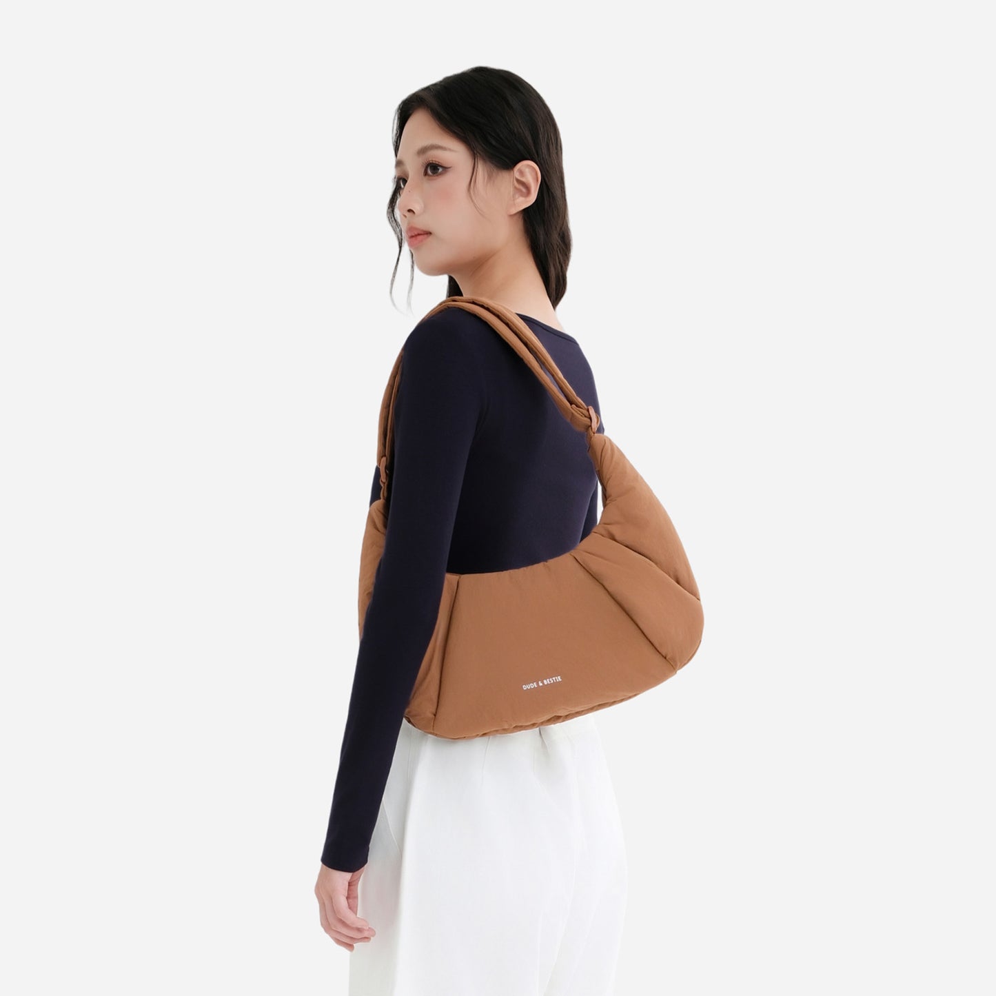 A Mocha brown puffer shoulder croissant bag by dude & bestie