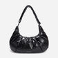 A black shiny Croissant-shaped shoulder bag with a single strap in polish black color