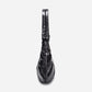 A black shiny Croissant-shaped shoulder bag with a single strap in polish black color