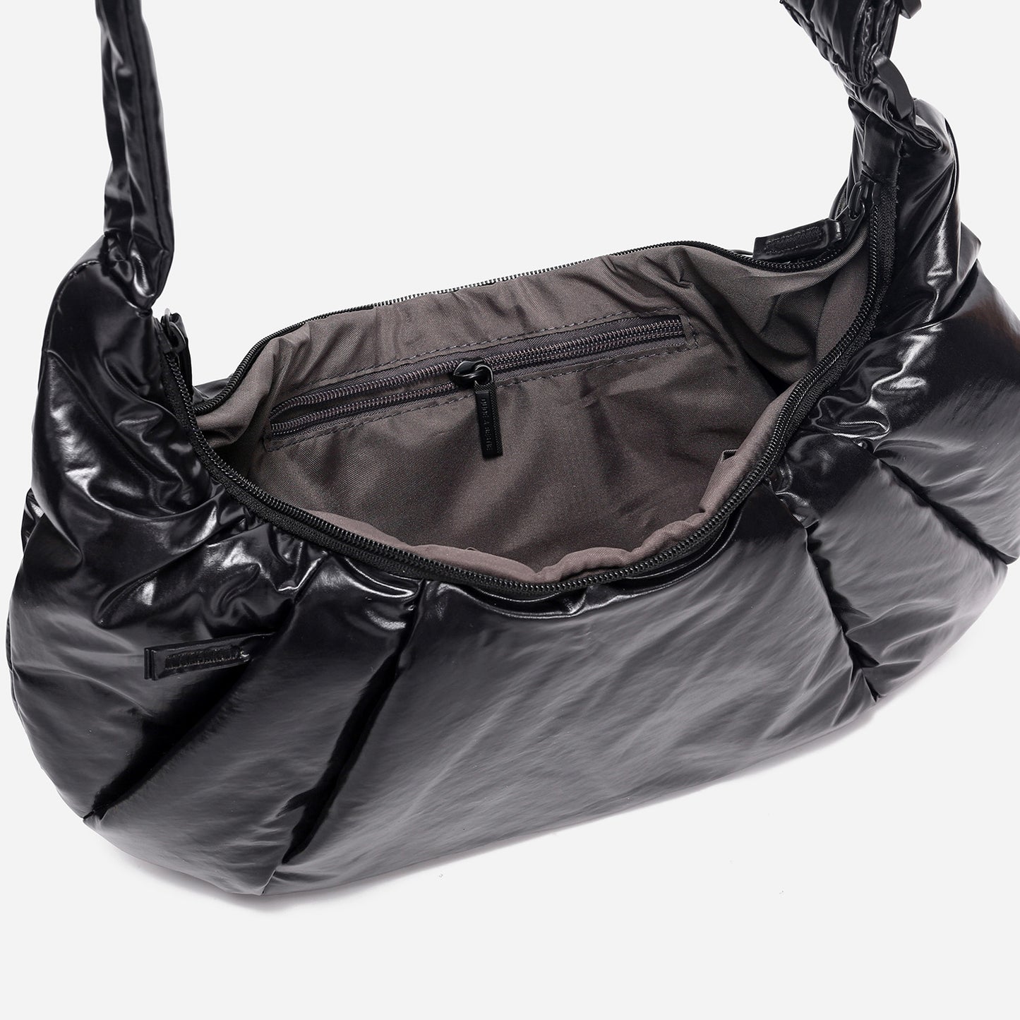A black shiny Croissant-shaped shoulder bag with a single strap in polish black color