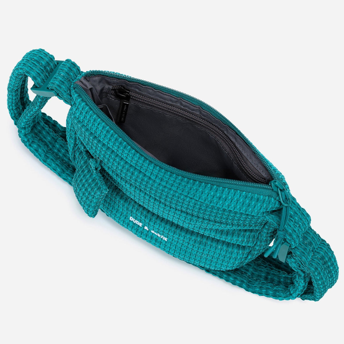 A teal woven corduroy shoulder bag by Dude & Bestie Winter 2026 Series