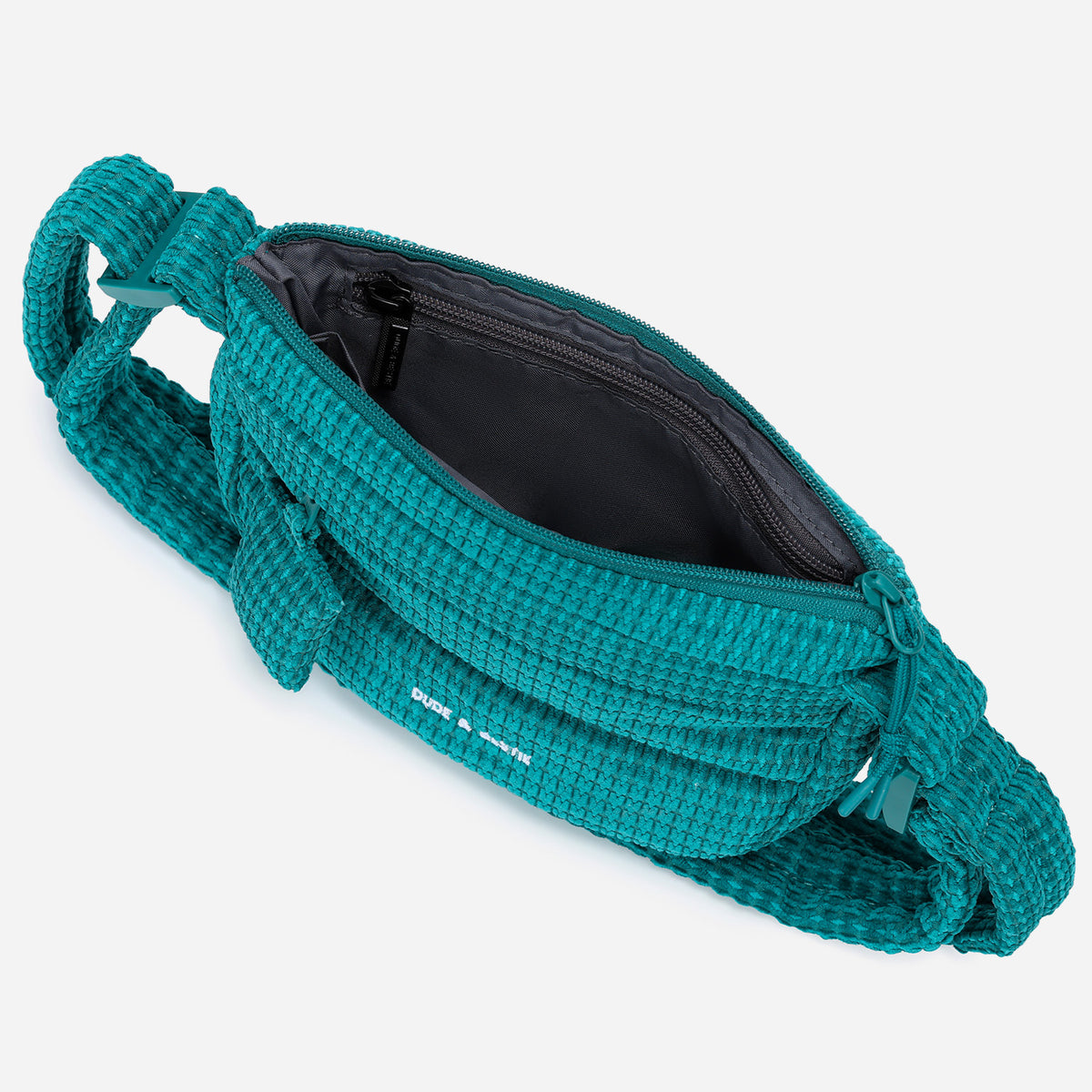 A teal woven corduroy shoulder bag by Dude & Bestie Winter 2026 Series